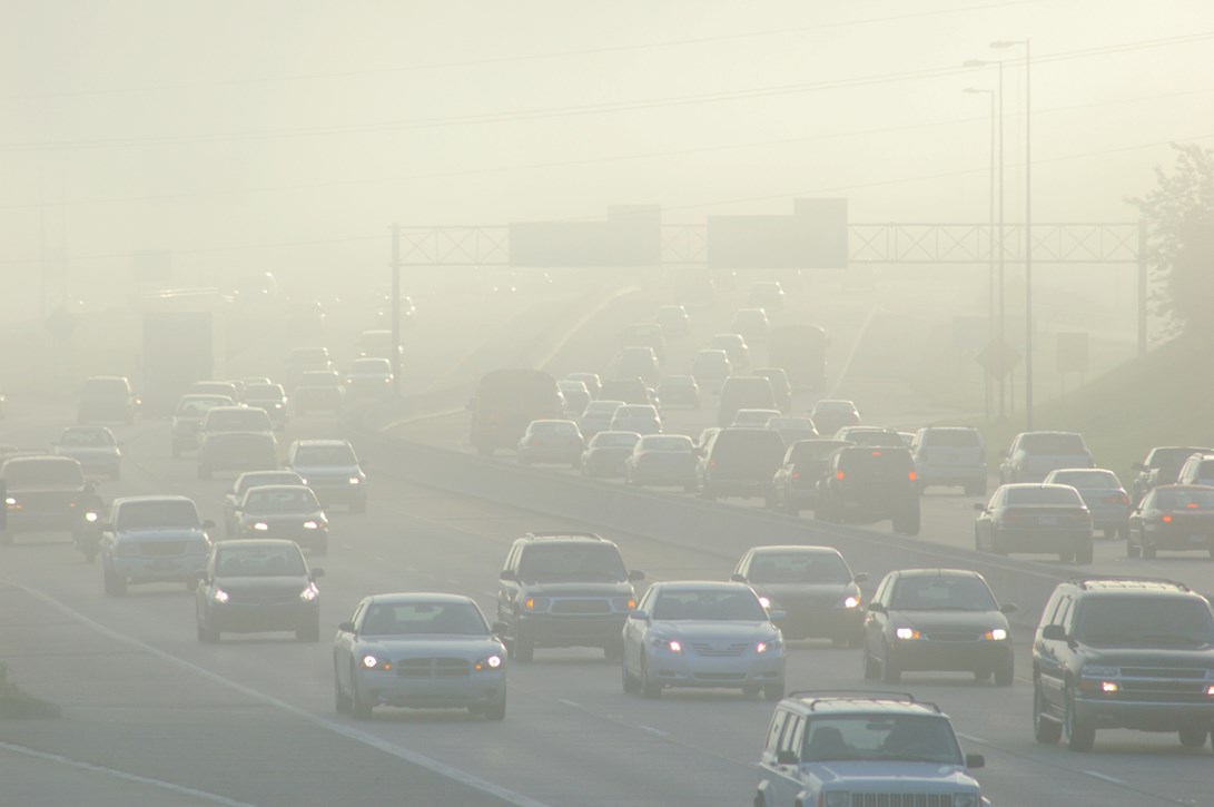 Crowded highway with heavy air pollution. 