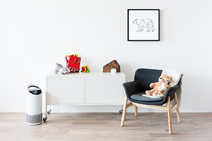 Medium air purifier on the floor in child room