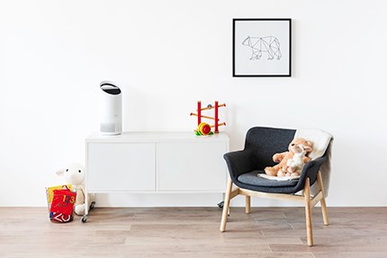 small room air purifier on dresser in child room